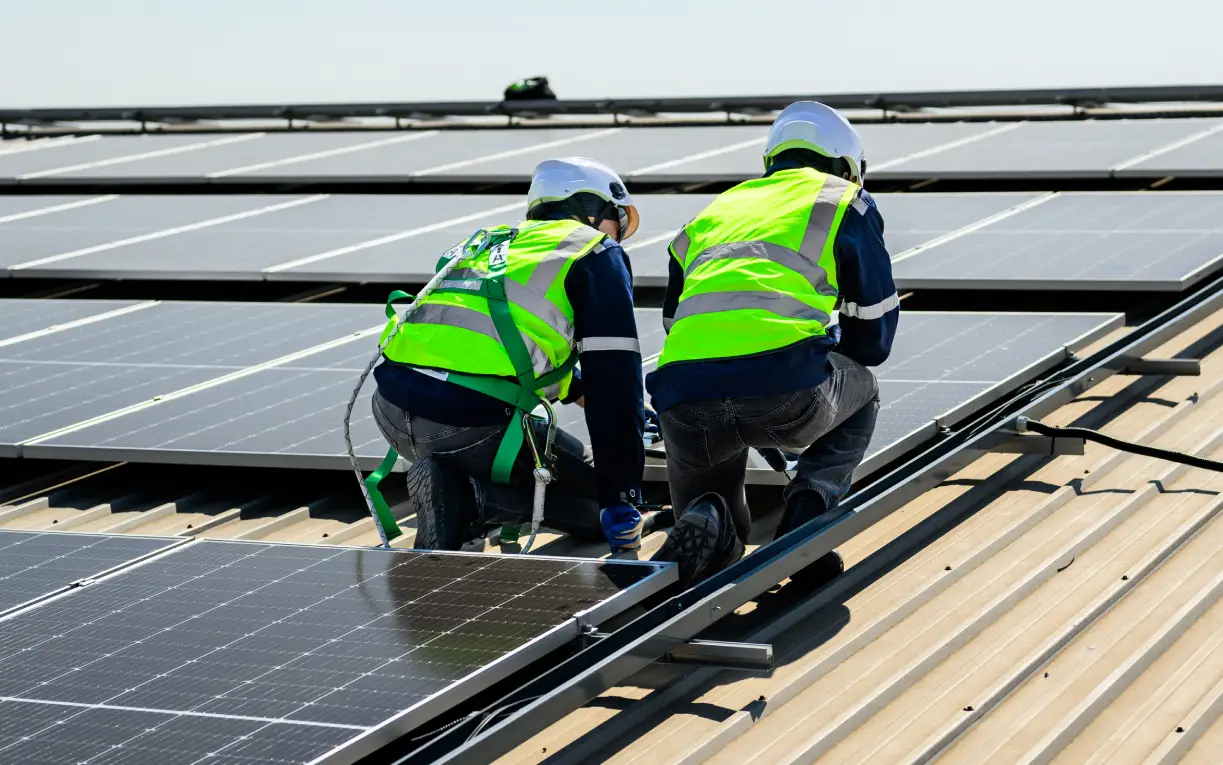 Engineers reviewing a solar installation together