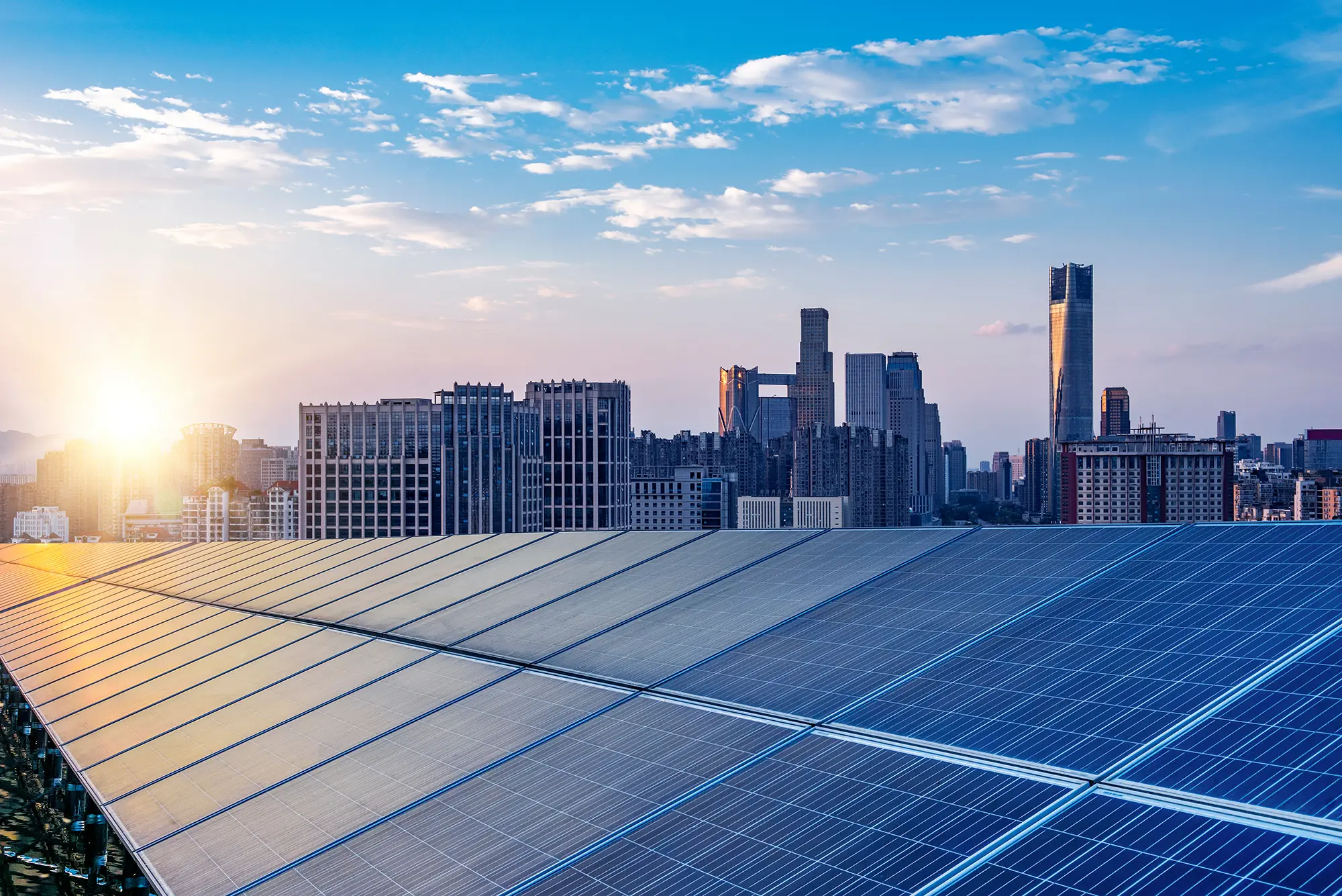 Solar panels above a city skyline