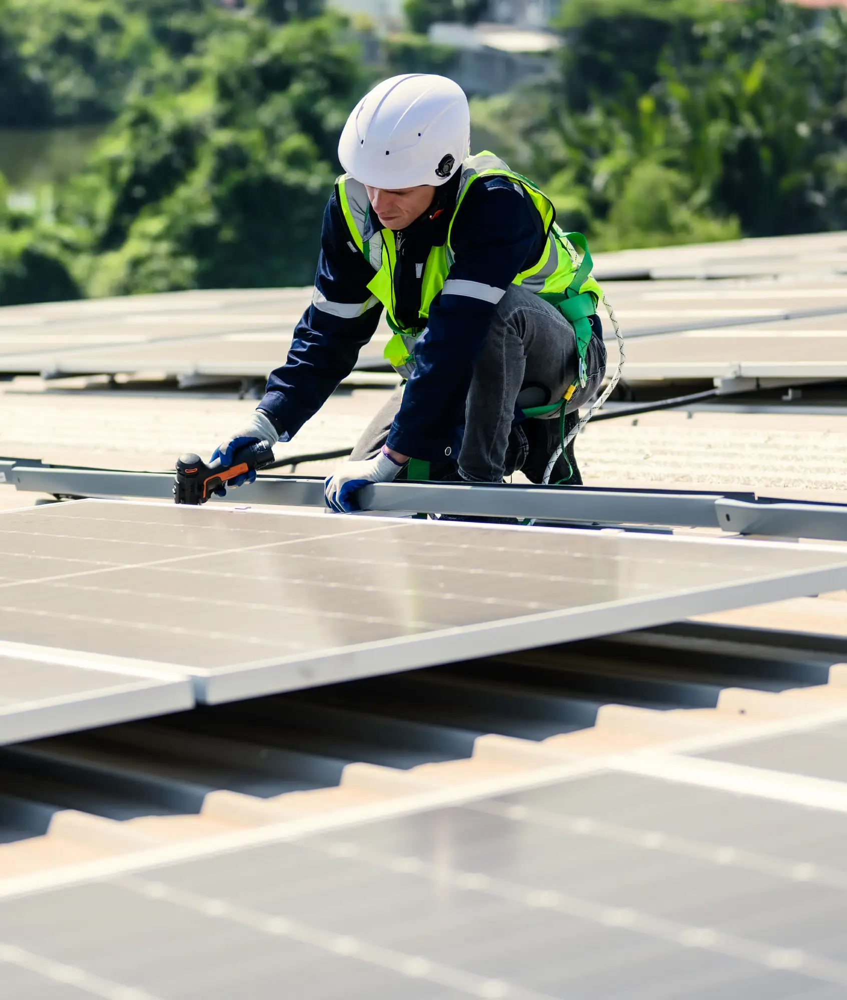 Engineer working carefully on a rooftop solar array